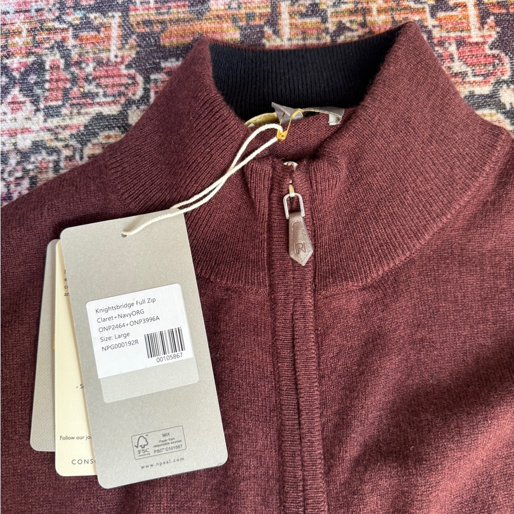 Men’s burgundy cashmere sweater in size Large
NWT never worn
